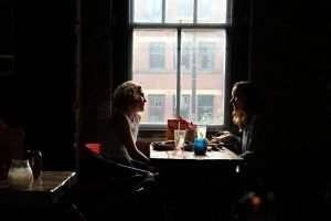 Two friends talking to prepare for a suburbs job interview
