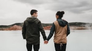 A couple holding hands.