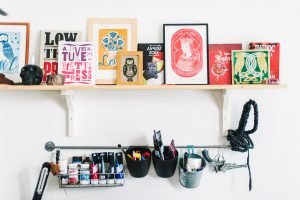 A shelf with clutter items.