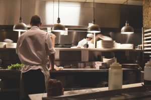 Kitchen staff in successful restaurant in one of the best parts of suburbs for young entrepreneurs 