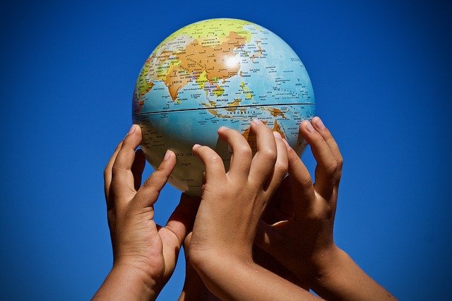 Kids holding a planet.