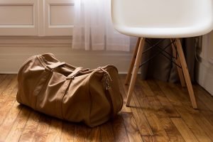 A brown bag on a wooden floor
