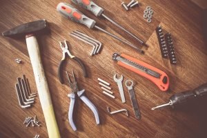 Packing a king-size bed and dissembling it with tool kit 