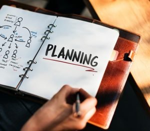 A notebook with planning writen on it