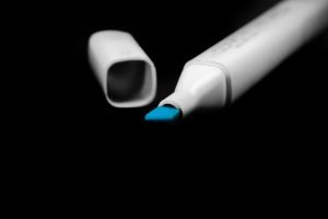 A blue marker on a black background