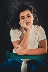 Woman wondering before disassembling furniture for a move