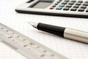 calculator, pen and a ruler