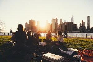 people spending last days before long distance relocation in the park