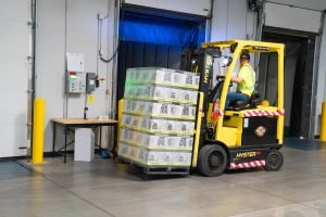 A moving company worker with some moving boxes