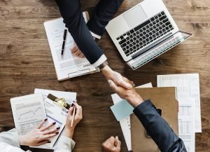 a handshake over the desk